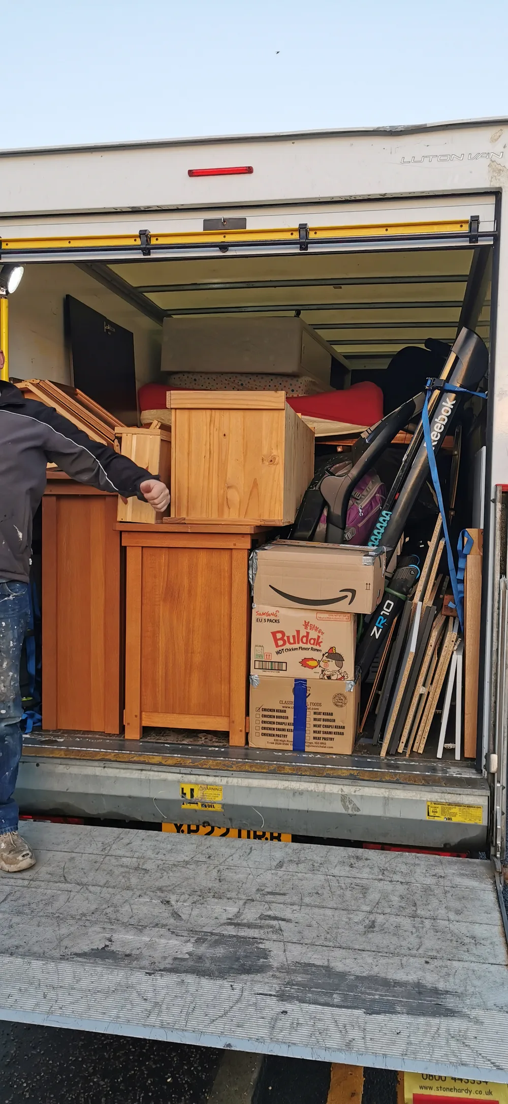 A DNE-supplied photograph of furniture and household belongings loaded in a removal van